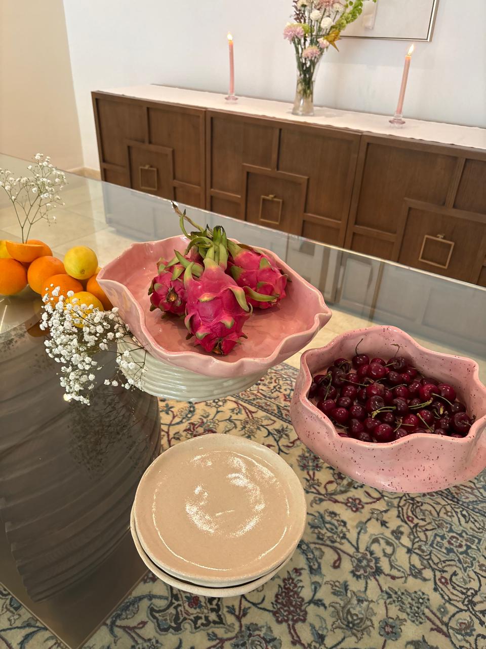Dragon fruit and cherry bowls styled with fruit and flowers