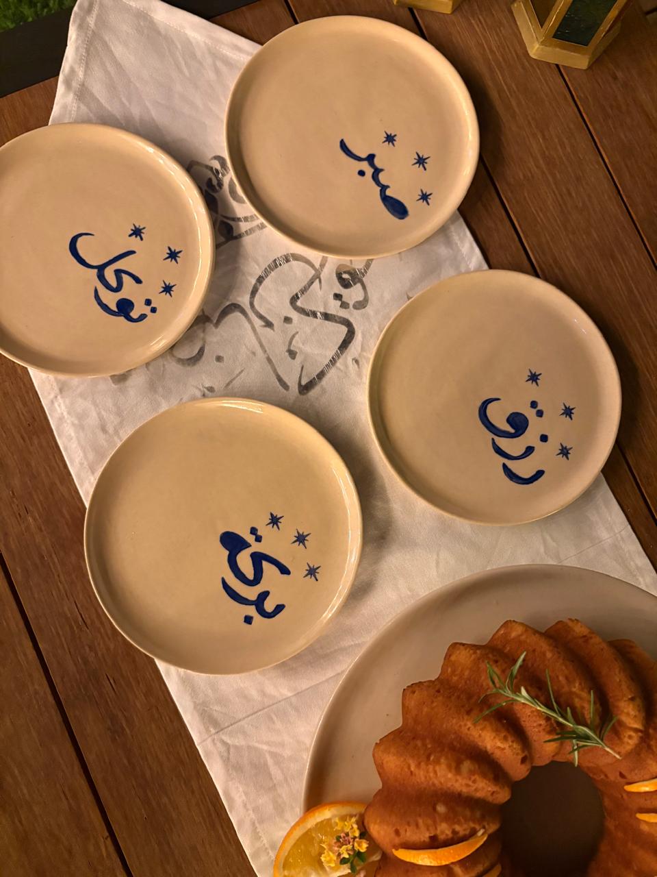 four plates with cake